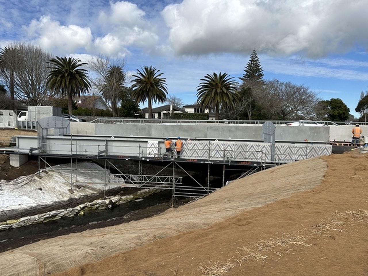 Finished pedestrian bridge with a patterned steel screen, Auckland